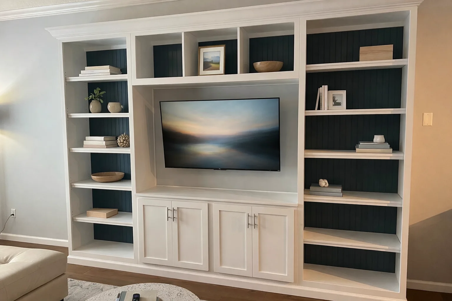White living-room built-in with dark inset shelving
